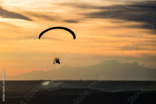 Paragliding with sunset sky with motor