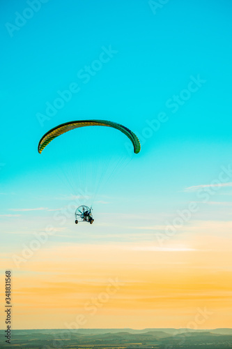 Paragliding with sunset sky with motor