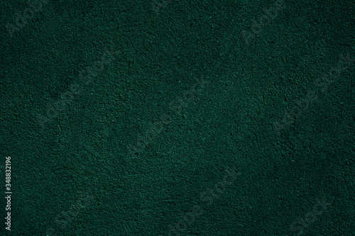 Dark green black textured background. Dark green grunge cement wall texture for interior design.
