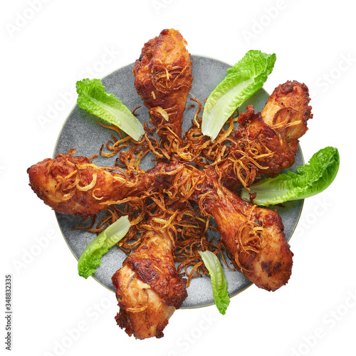 Bild auf Leinwand Gai Tod Hat Yai or Thai Deep Fried Chicken on gray plate isolated on white background