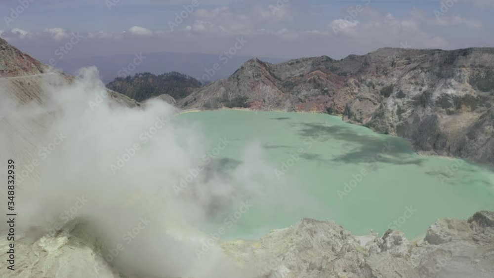 Aerial view of beautiful crater lake in mountains with clouds Aerial view of beautiful crater lake in mountains with clouds