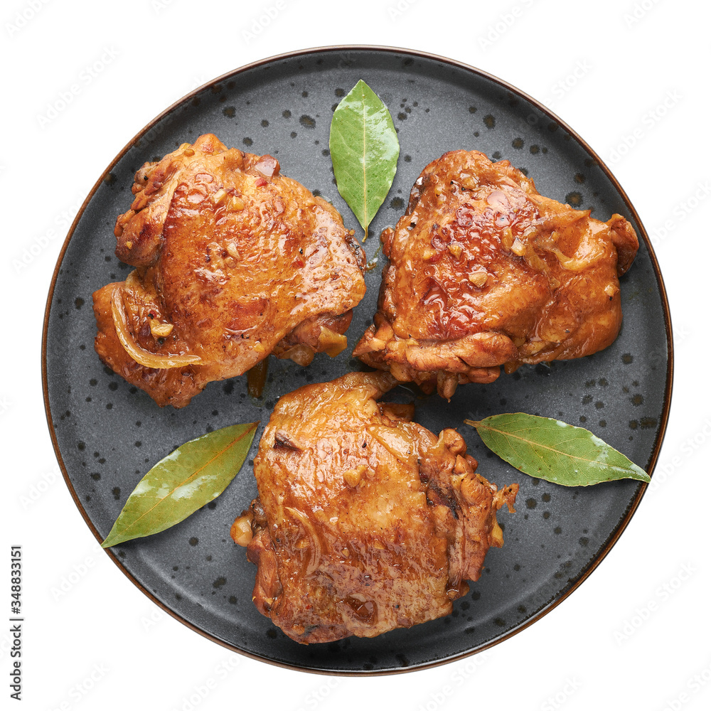 Filipino Chicken Adobo on dark gray plate isolated on white backdrop. Chicken Adobo is Filipino