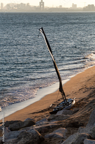 Windsurf board on the sunset at the beach of mediterranean sea, Maresme, El Masnou, Catalonia, Spain.