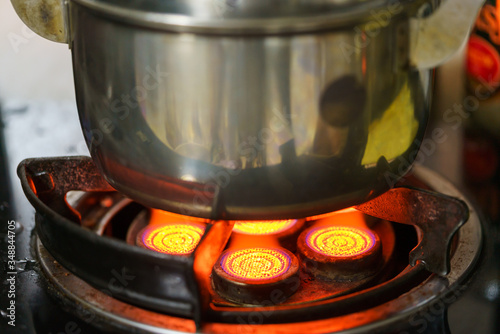 The infrared gas burner is boiling the soup in the pot.