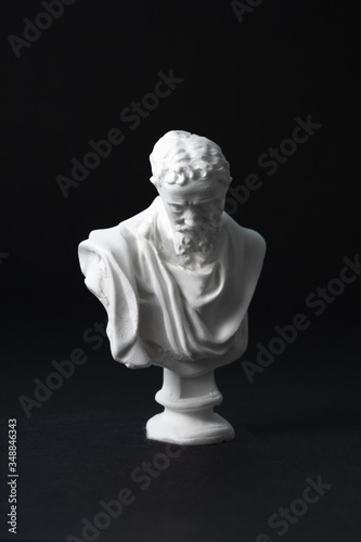 Michelangelo plaster figure in black background