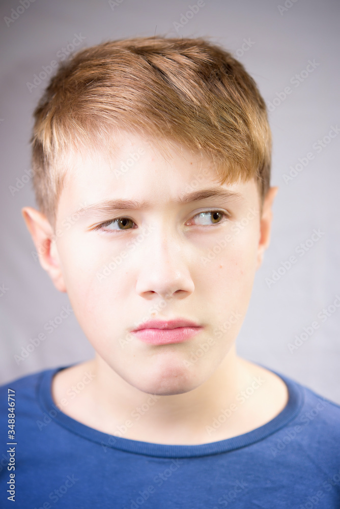 Emotional portrait of a 10-12 years boy. Emotional Portrait of sadness, depression and anxiety. Emotional portrait of a 10-12 years boy. Emotional Portrait of sadness, depression and anxiety.
