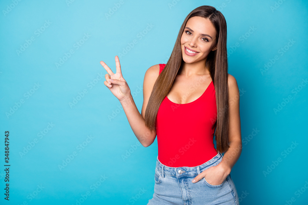 Portrait of candid pretty cute sweet lovely girl enjoy spring rest relax make v-sign wear good look tank-top isolated over blue color background - obrazy, fototapety, plakaty 