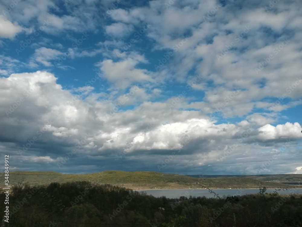 stormy clouds over green forest in summer season stormy clouds over green forest in summer season