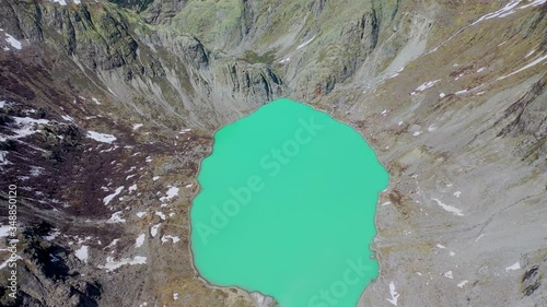 Incredible hidden natural lake between the alps mountain in Switzerland,aerial view photo