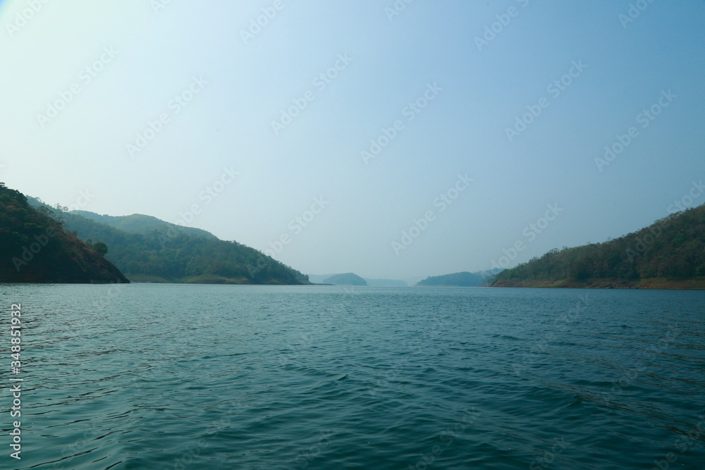 Fototapeta premium Misty morning mountain in a dam. 