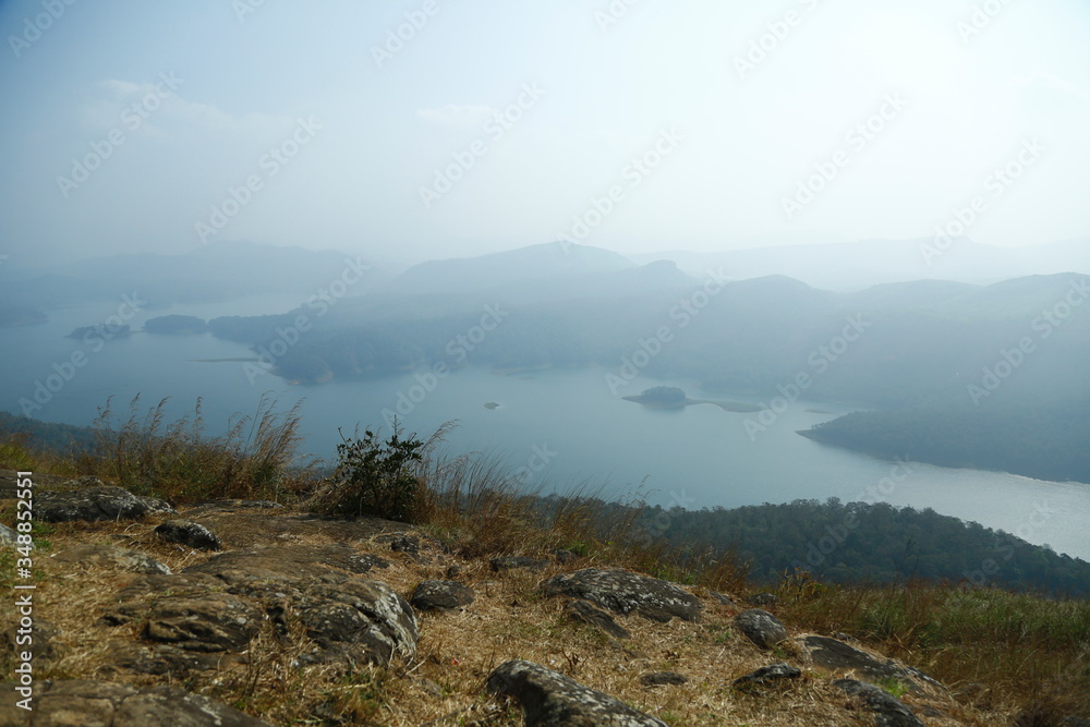Fototapeta premium Misty morning mountain in a dam. 