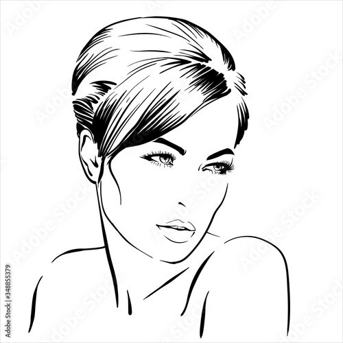 Beautiful brunette girl portrait. Bun hairstyle. 