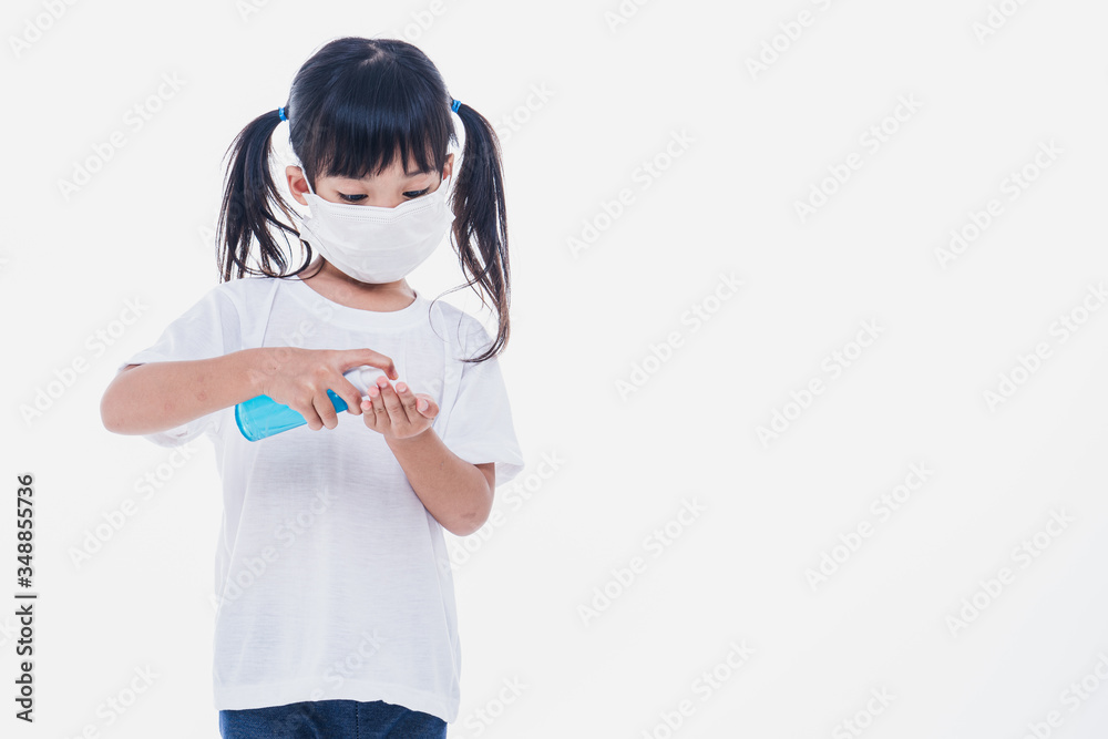 Asian little cute girl wearing a mask to protective spread the disease on white background. Prevention of spreading the corona virus COVID-19 cold flu or pollution. Asian little cute girl wearing a mask to protective spread the disease on white background. Prevention of spreading the corona virus COVID-19 cold flu or pollution.