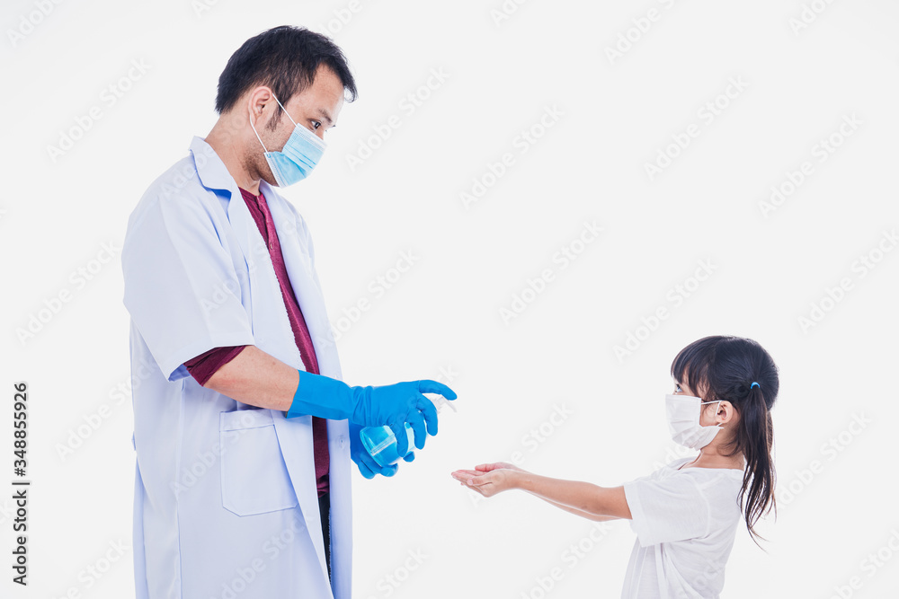 Coronavirus. doctor in a protective suit, mask tells child how to use the sanitizer. Preventive measures against Covid-19 infection. Аntibacterial gel with alcohol-based hand-washing spray. Coronavirus. doctor in a protective suit, mask tells child how to use the sanitizer. Preventive measures against Covid-19 infection. Аntibacterial gel with alcohol-based hand-washing spray.