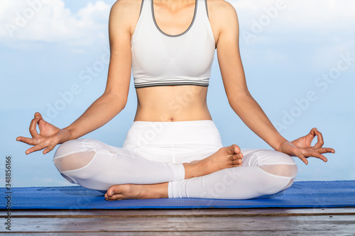Women exercising or yoga Breathe in the natural air Concepts of meditation, peacefulness, relaxation, sports and recreation, good health.