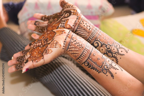 Indian bride showing mehndi tattoos design