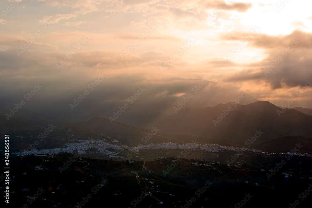 Sun rising over the Town of  Frigiliana, Malaga Province, Axarquia, Andalusia, southern Spain.