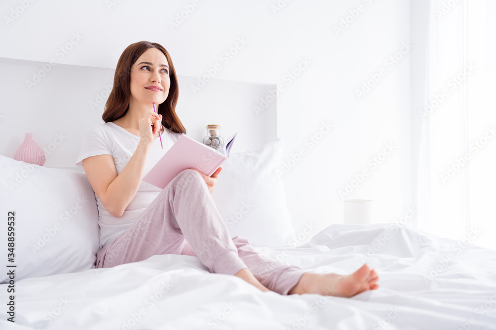 Portrait of her she nice attractive lovely charming dreamy creative cheerful cheery red haired girl sitting in bed creating story in modern white light interior style room house apartment Portrait of her she nice attractive lovely charming dreamy creative cheerful cheery red haired girl sitting in bed creating story in modern white light interior style room house apartment