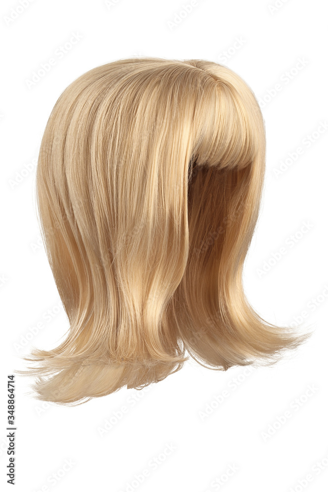 Subject shot of a natural looking caramel blonde wig with bangs. The shoulder-long wig with twisted strands is isolated on the white background. Subject shot of a natural looking caramel blonde wig with bangs. The shoulder-long wig with twisted strands is isolated on the white background.