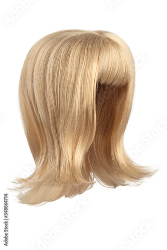 Subject shot of a natural looking caramel blonde wig with bangs. The shoulder-long wig with twisted strands is isolated on the white background. 