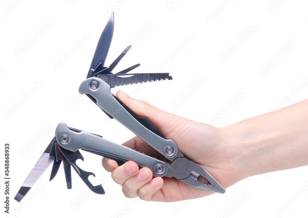 Multitool multi function tool hovers in hand on white background isolation Multitool multi function tool hovers in hand on white background isolation