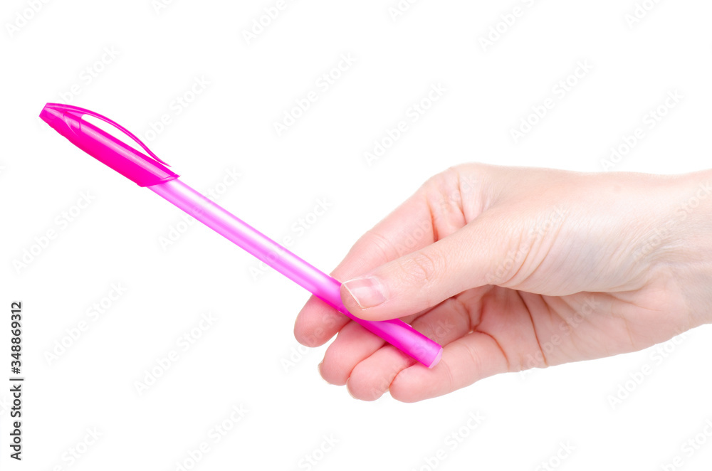 Pink pen in hand on white background isolation Pink pen in hand on white background isolation