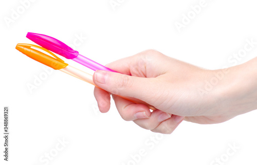 Two pen in hand on white background isolation