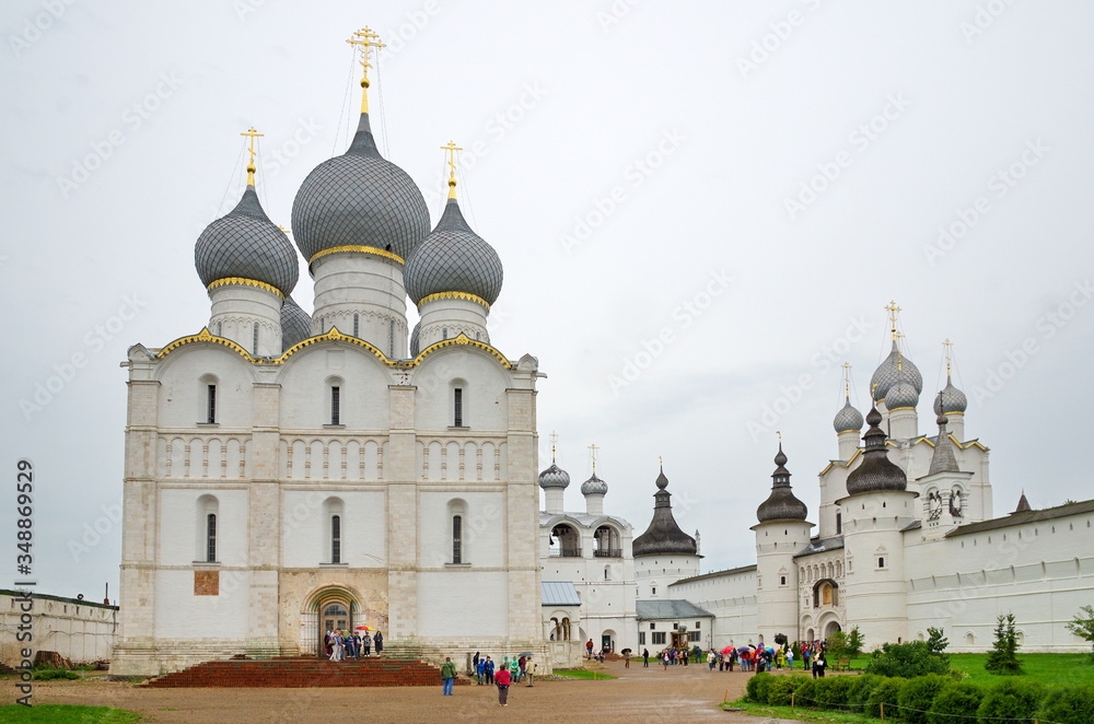 Rostov Veliky, Russia - July 24, 2019: Assumption Cathedral on Cathedral square and the Holy gates in the Rostov Kremlin. Golden ring of Russia