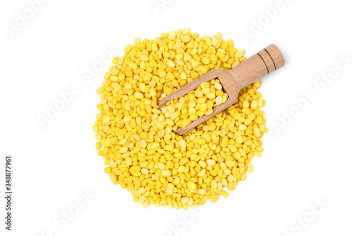 Flat lay Dried mung beans peeled with wooden spoon isolated on white background.
