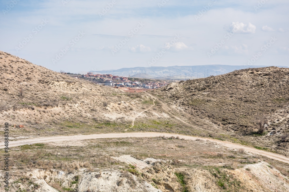Hills and village in Cappadocia,Turkey. Hills and village in Cappadocia,Turkey.