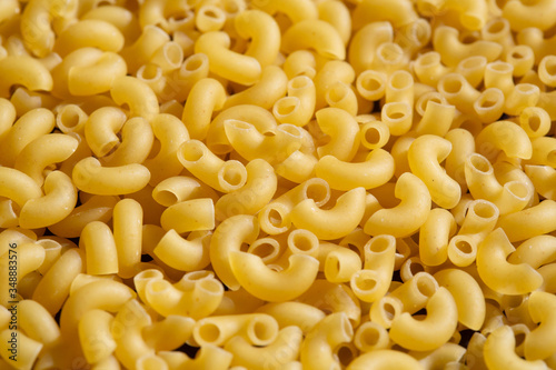 italian dry pasta horns, closeup background scattering, texture
