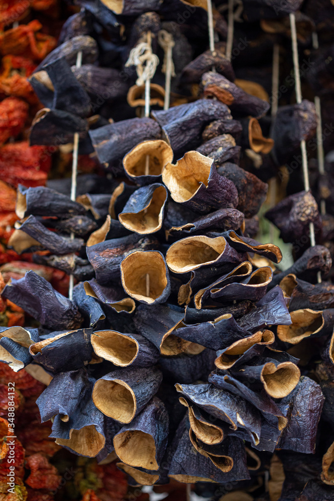 Fototapeta premium Dry eggplant and dry bell chili hanging on sale at shop
