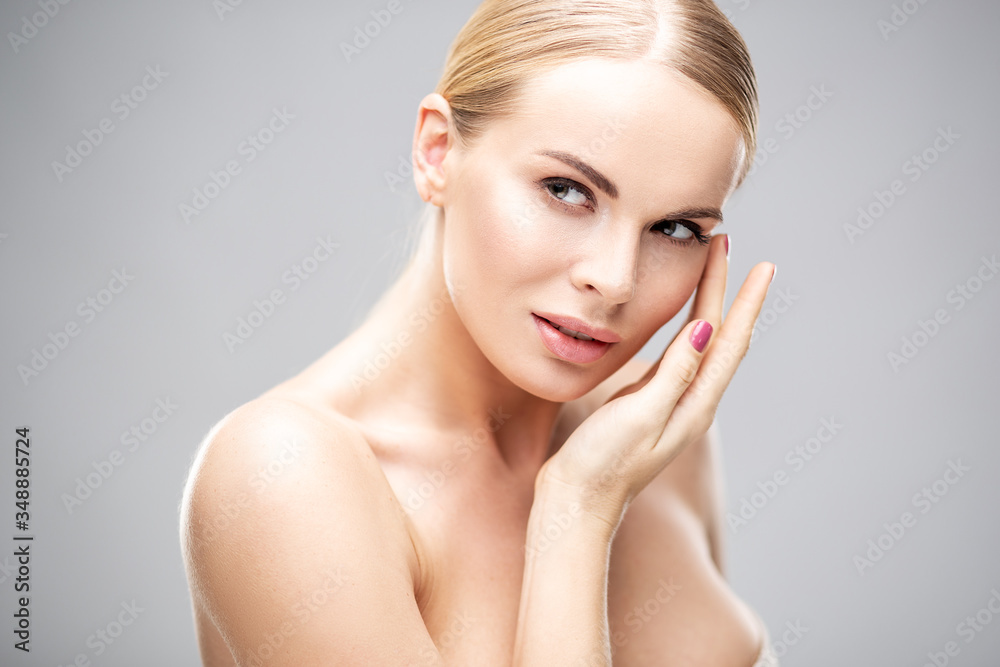 Beauty portrait of young woman with healthy skin and soft natural make up. Spa and care. Long beautiful blonde hair Beauty portrait of young woman with healthy skin and soft natural make up. Spa and care. Long beautiful blonde hair