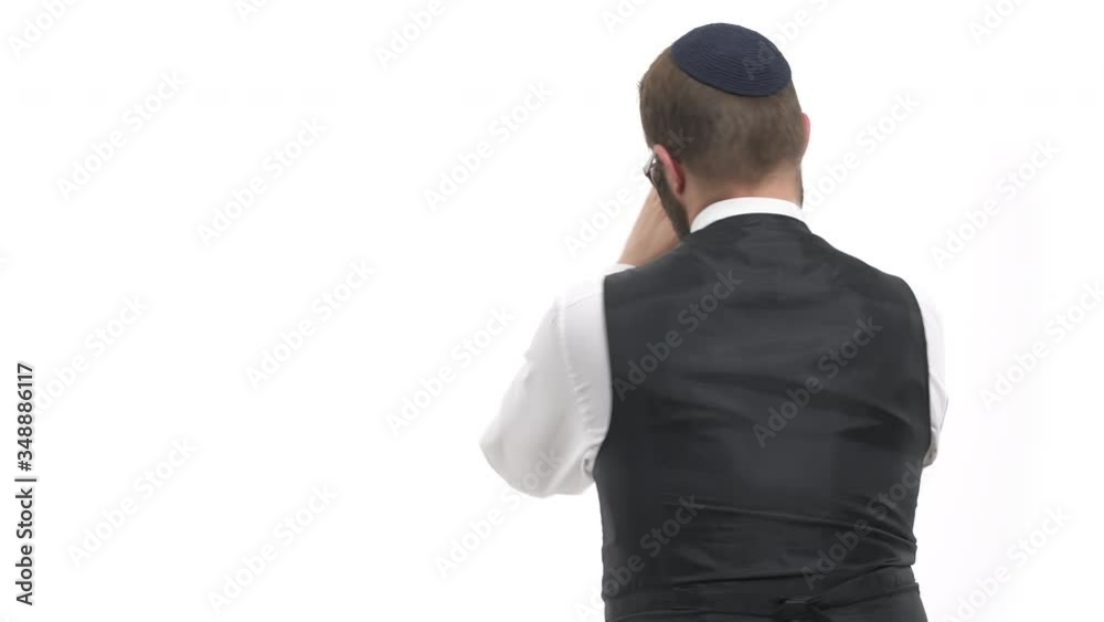 Young man dancing. Model is turning around and applauding. Isolated, on white background Young man dancing. Model is turning around and applauding. Isolated, on white background