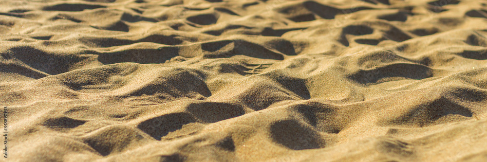 Closeup of sand pattern of a beach in the summer Closeup of sand pattern of a beach in the summer