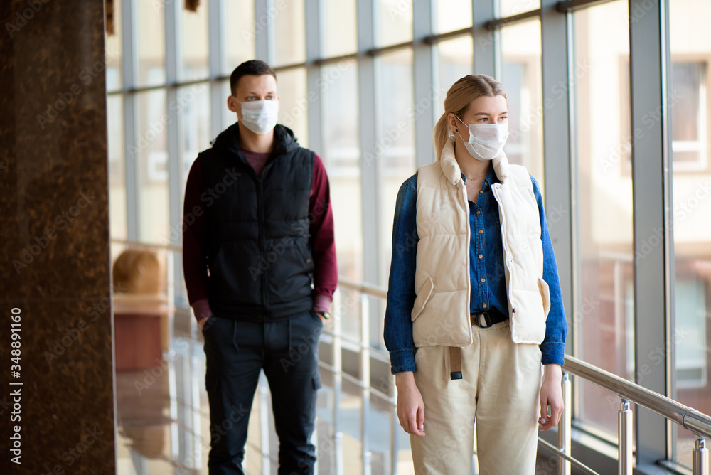 Concept of coronavirus quarantine. MERS-Cov, Novel coronavirus, man and woman with medical face mask Concept of coronavirus quarantine. MERS-Cov, Novel coronavirus, man and woman with medical face mask