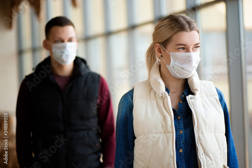 Concept of coronavirus quarantine. MERS-Cov, Novel coronavirus, man and woman with medical face mask