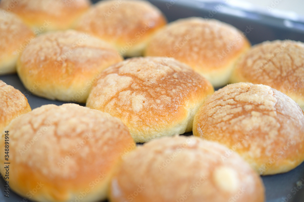 Baked buns on  tray. Baking at home