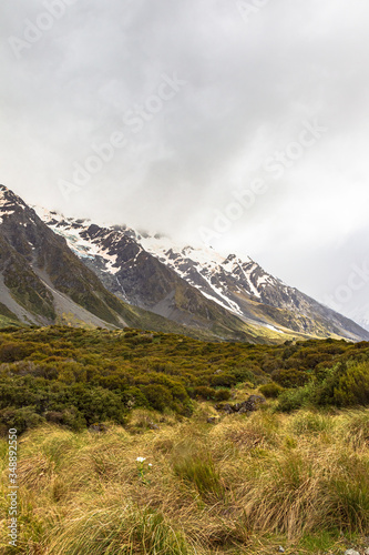 Valley in the Southern Alps among snow-capped mountains. South Island, New Zealand