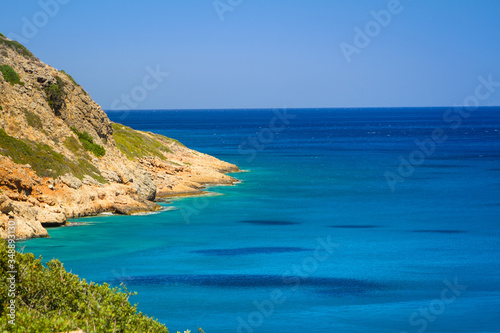 Turquise water of Mirabello bay at the coastline of Crete, Greece © Patryk Kosmider