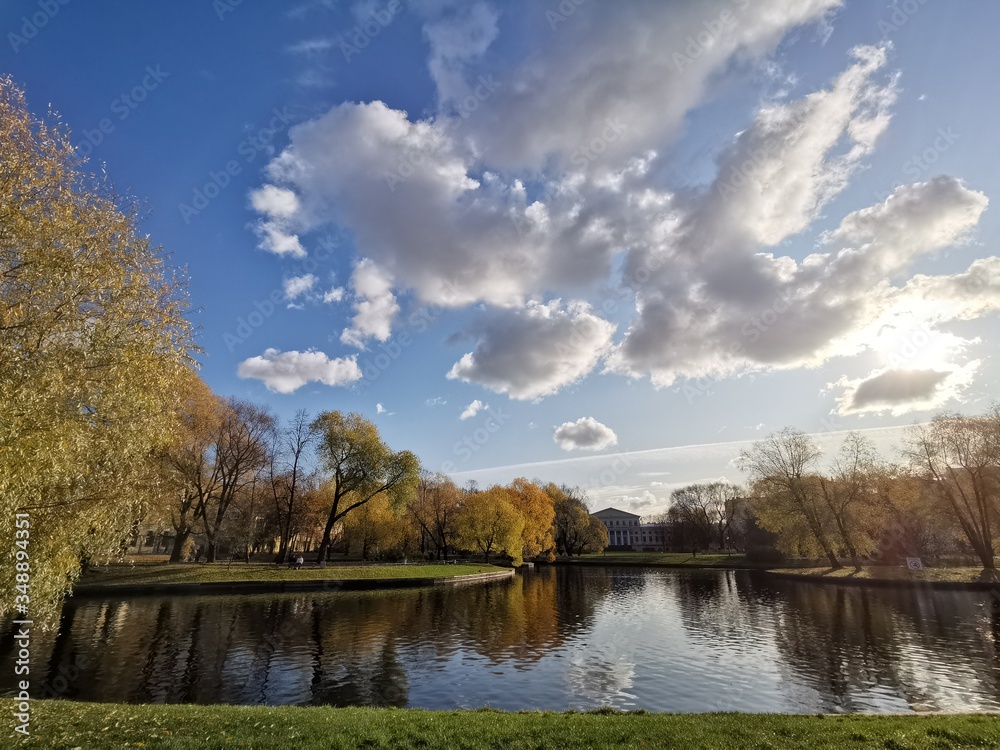 Autumn landscape in a city park, with reflection in the  water.  (HDR)