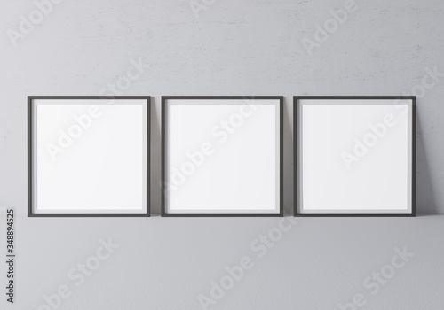 Fototapeta Naklejka Na Ścianę i Meble -  Black square frame mock up. Frame poster standing on gray floor. 3D illustrations.	