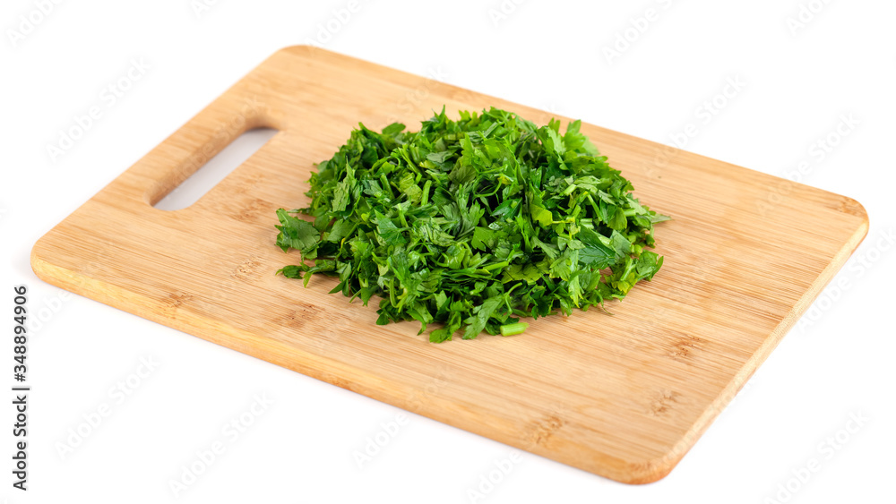 chopped parsley leaf on wooden a board isolated on white background chopped parsley leaf on wooden a board isolated on white background