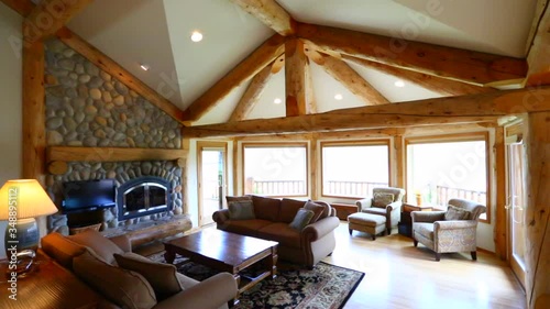 Large beautiful home horse ranch on the side of the mountain near large Lake Chelan in Eastern Washington. Home exteriors and green landscaping. 
