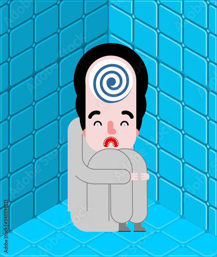 Mad man in lunatic asylum. Crazy man in nuthouse.