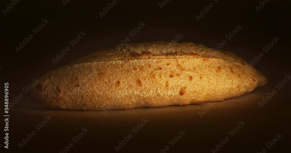 Rising and baking of white bread in bakery oven, timelapse video. Crusty of bread.