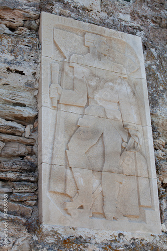 Stone bas-relief in the rocks off the coast photo