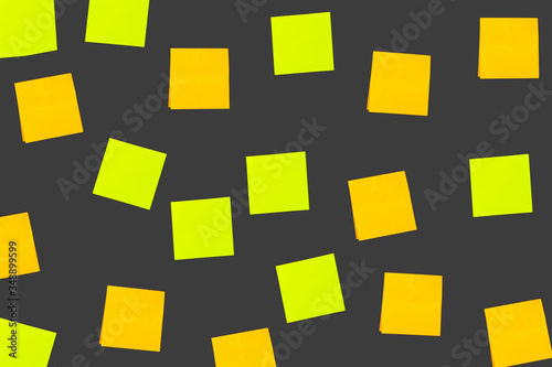 orange and green post it papers on the grey wall illustration. blank note paper
