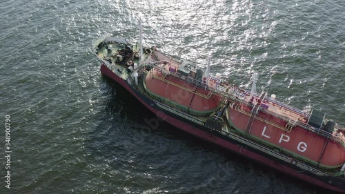 energy export and import business for transportation trade. aerial top view of the ship carrying the lpg and oil tanker in the sea port with vessel global logistics at sunset.