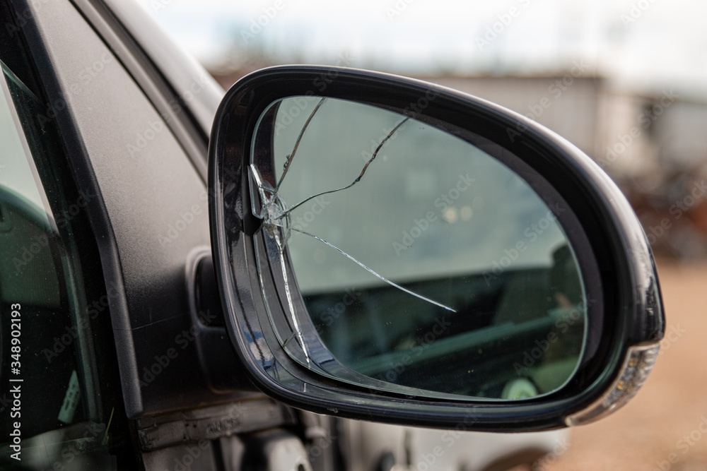Car with broken side door mirror